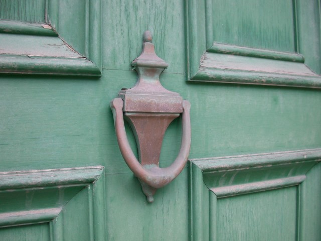 green door with old knocker